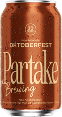 Non-alcoholic Oktoberfest beer can from Partake Brewing with water droplets on surface.