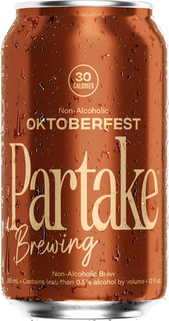 Non-alcoholic Oktoberfest beer can from Partake Brewing with water droplets on surface.